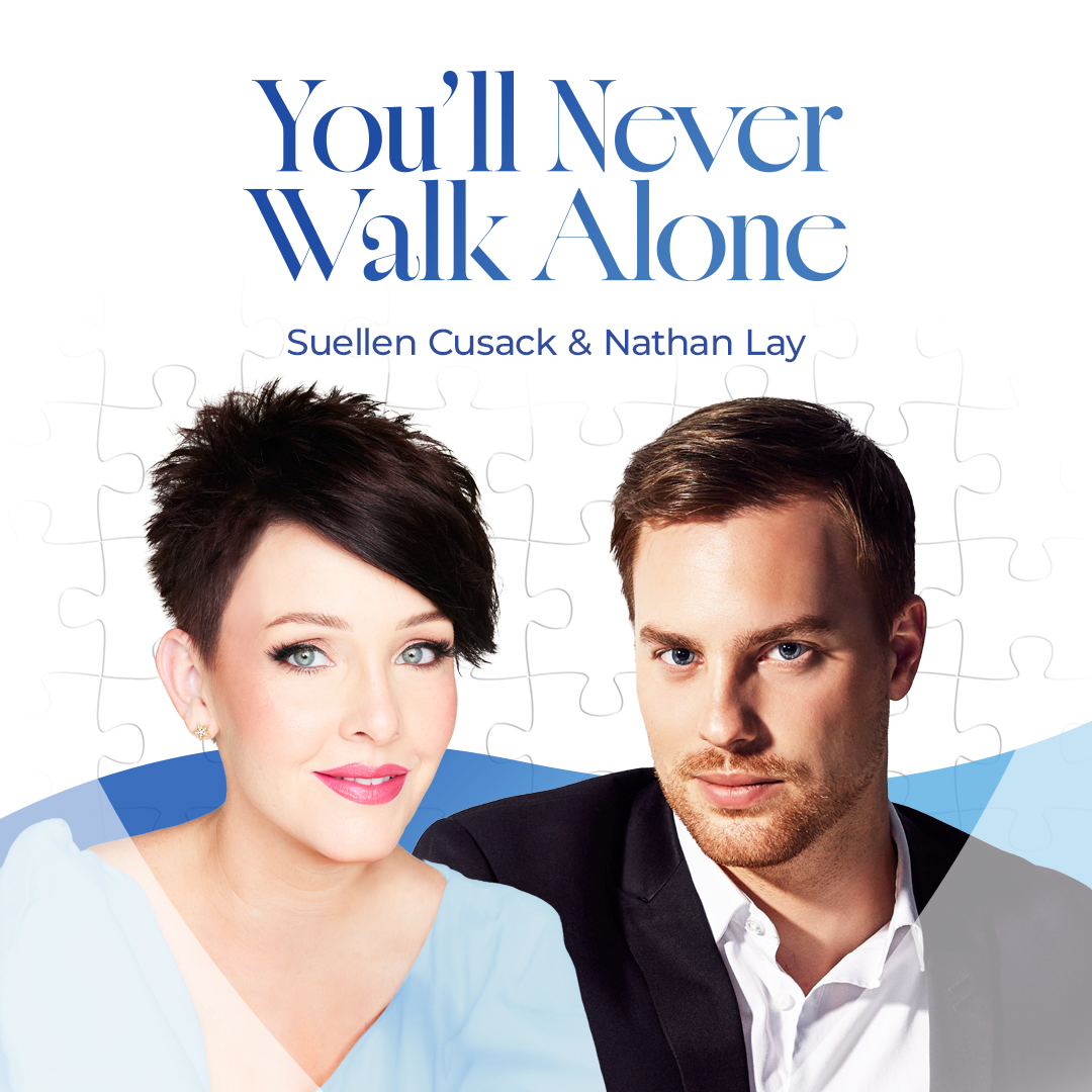 Suellen Cusack & Damien Leith on the artwork for their duet release 'Silent Night' Suellen Cusack is wearing a red gown and Damien Leith is wearing a white shirt with a black sequin suit.